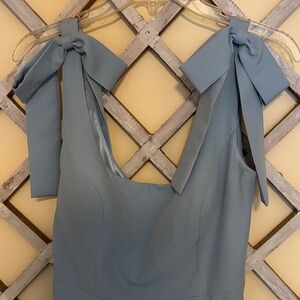 Elegant Blue Sleeveless Top with Bow Details